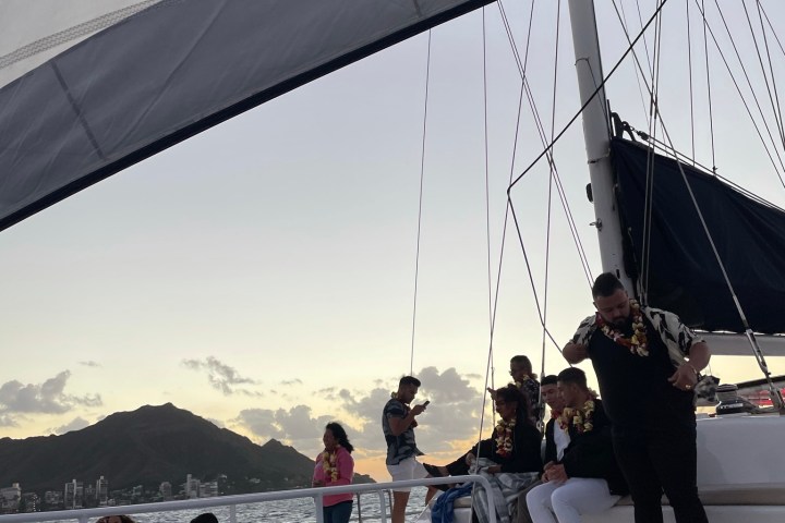 a group of people standing on a bridge