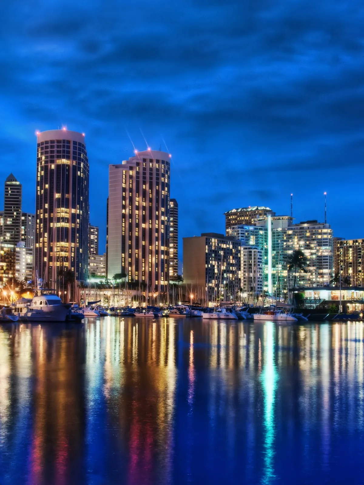 a body of water with a city in the background