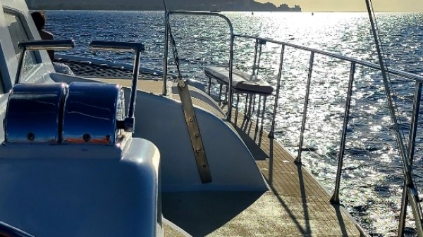 a boat is docked next to a body of water