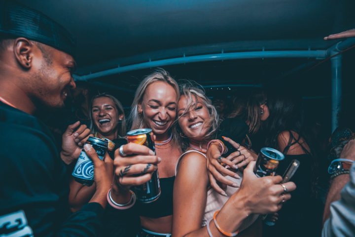 a group of people looking at a cell phone