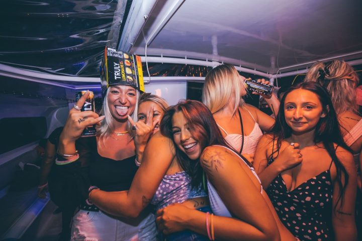 a group of people on a stage posing for the camera