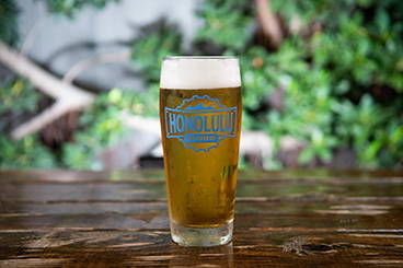 a glass of beer on a table