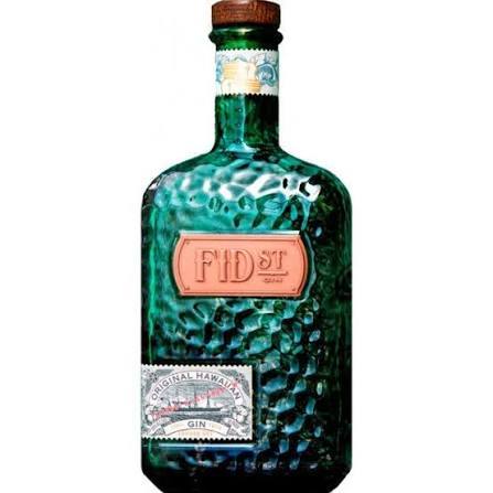 Textured green bottle with label, wooden cap, possibly gin.